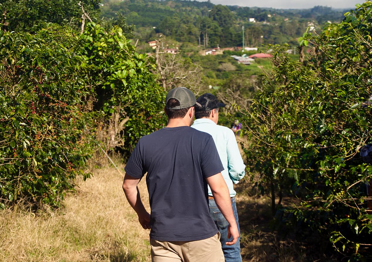 Two generations walking the farm